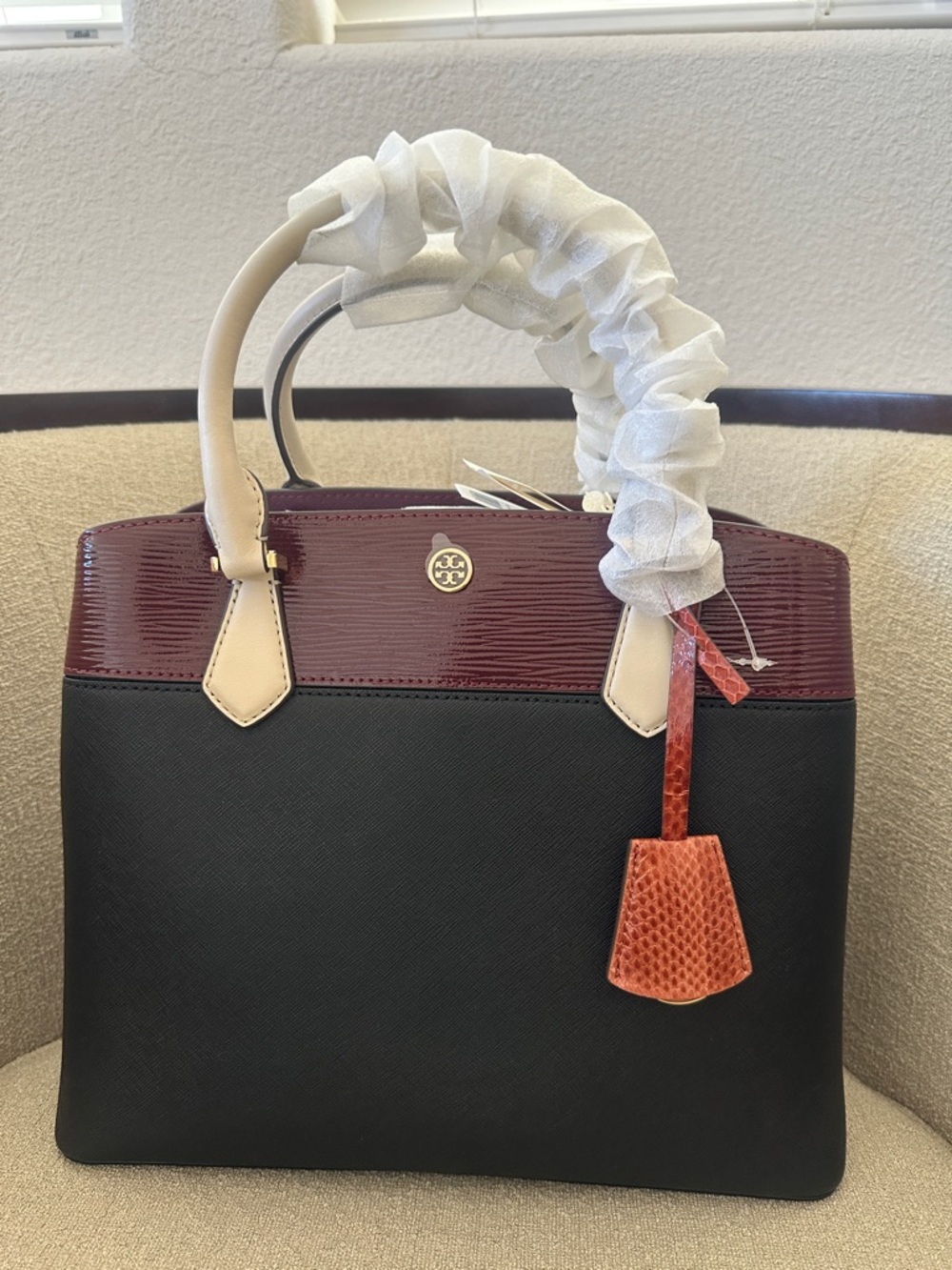 NWT Tory Burch Black and Burgundy Satchel with Tan Handles and Orange Charm - Picture 2 of 12
